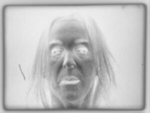 Person facing camera with exposure inverted.