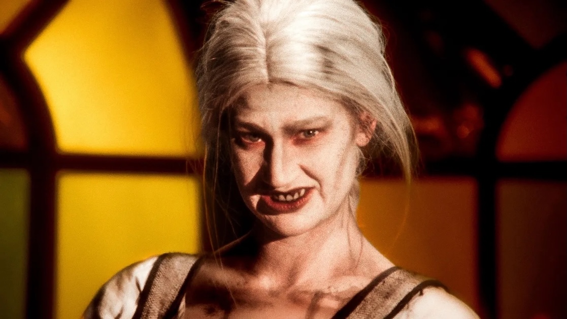 Image of a person with zombie makeup looking forward.