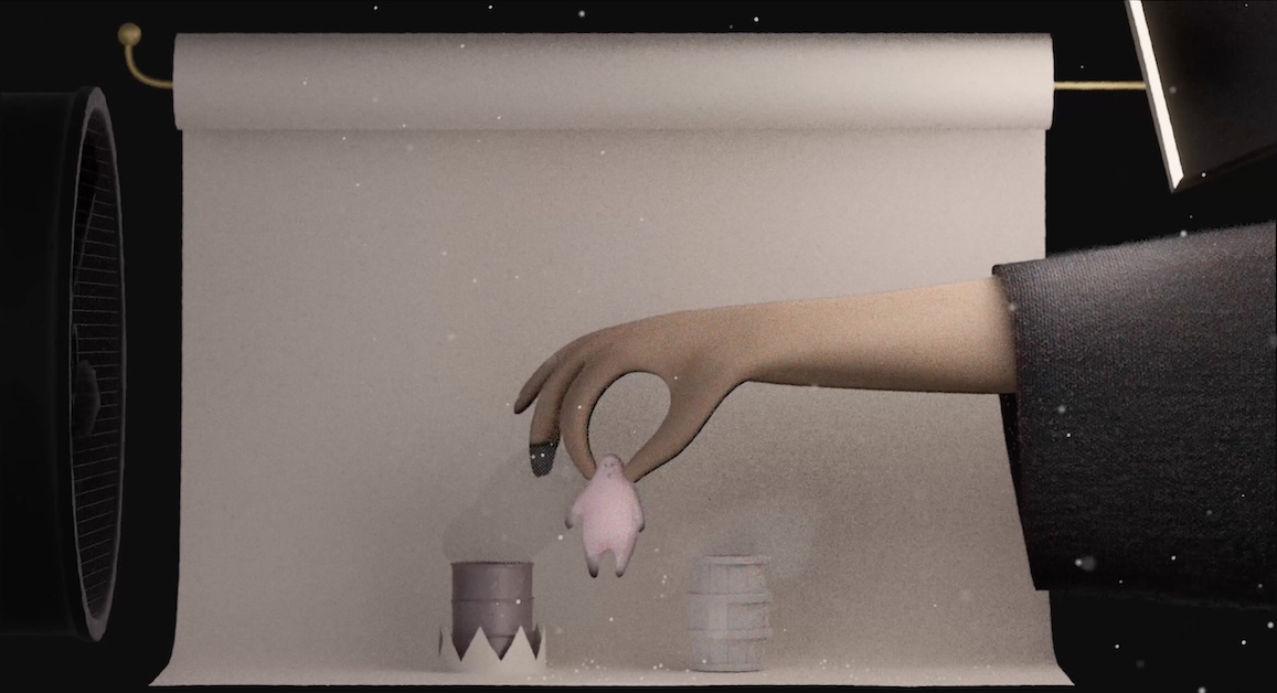 Image of animation featuring hand holding figure in front of white background.
