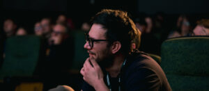 Person looking in theater.