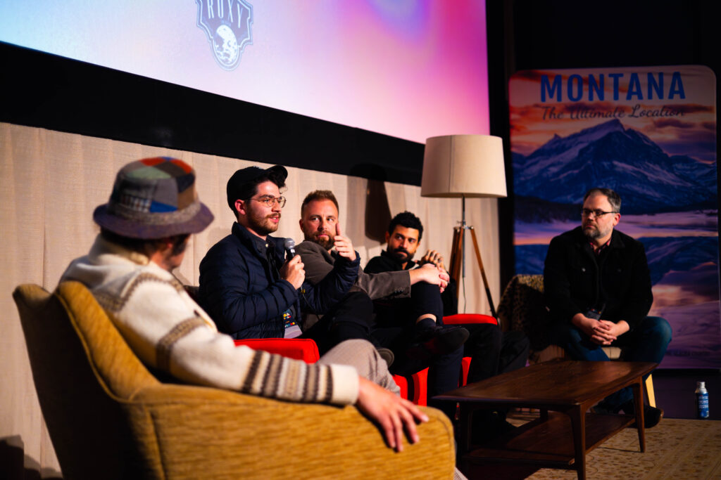 Group of people sitting and talking with mics