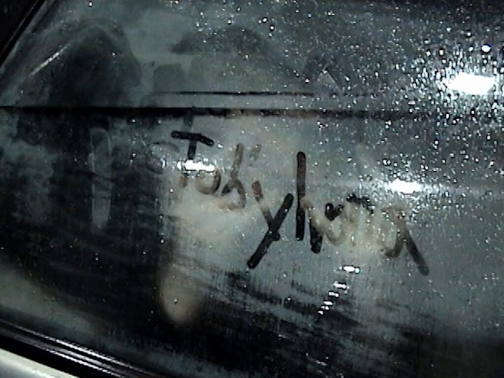Text on wet window.