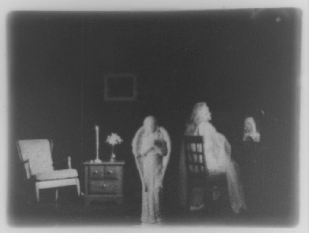 People in interior setting with low light.