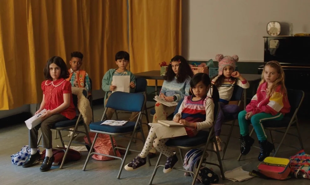 Image of a group of kids inside.