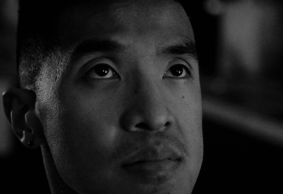 Image of black and white and a person's face looking up.