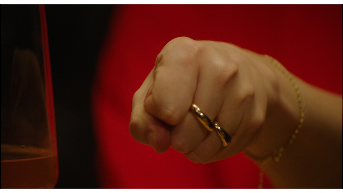 No_Hands1 Image of a fist with a ring with red background.