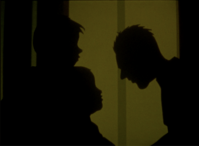 Image of shadows in front of yellow-green background.