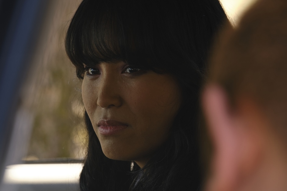 Person looks forward with other person off camera.