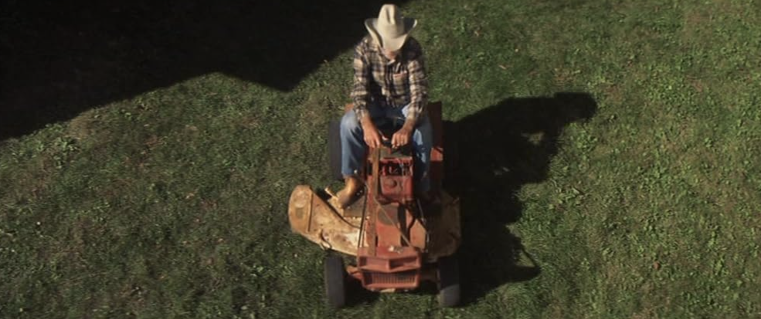 Image of person on tractor from above.
