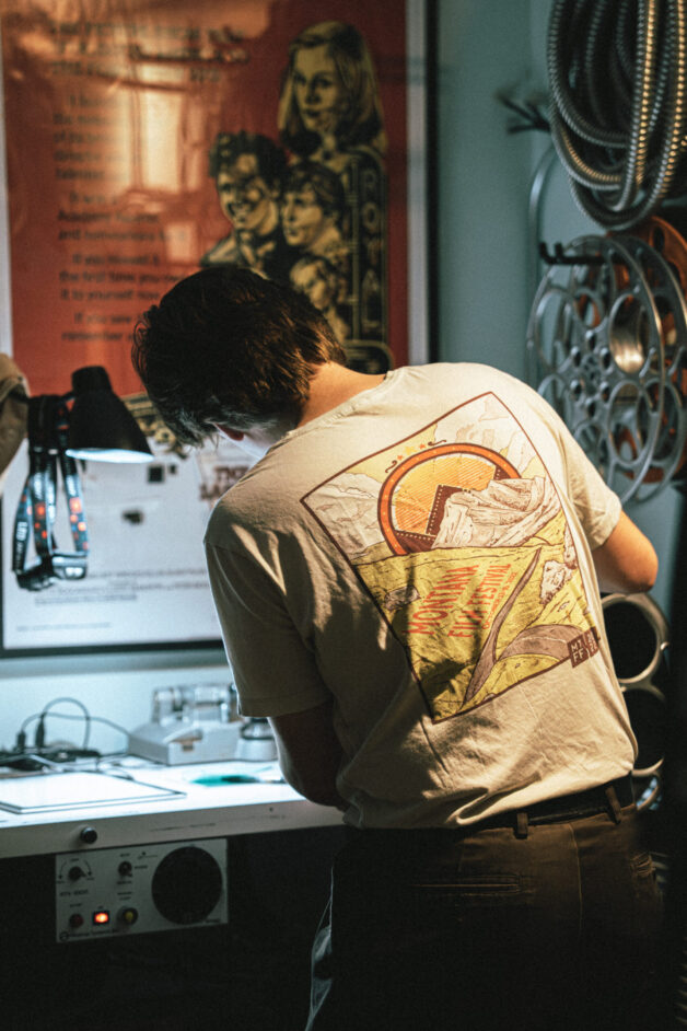 Person works with film.